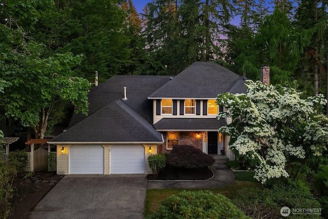 2892 160th Pl NE, Bellevue, WA 98008 - traditional-style home with driveway, a garage, a porch, a chimney, and roof with shingles