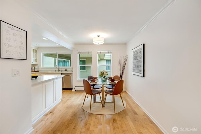 202 W Olympic Pl Unit 201, Seattle, WA 98119 - dining room with light wood-type flooring, ornamental molding, and recessed lighting