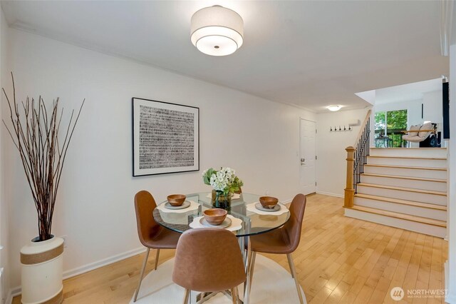 202 W Olympic Pl Unit 201, Seattle, WA 98119 - dining room with light wood-style floors and stairs