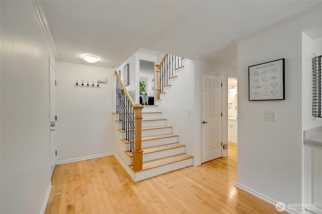 202 W Olympic Pl Unit 201, Seattle, WA 98119 - stairway with crown molding and hardwood / wood-style flooring