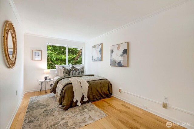202 W Olympic Pl Unit 201, Seattle, WA 98119 - bedroom featuring wood finished floors and ornamental molding