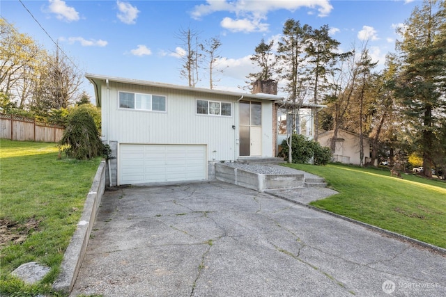2104 E Ave, Anacortes, WA 98221 - bi-level home with an attached garage, concrete driveway, and a chimney