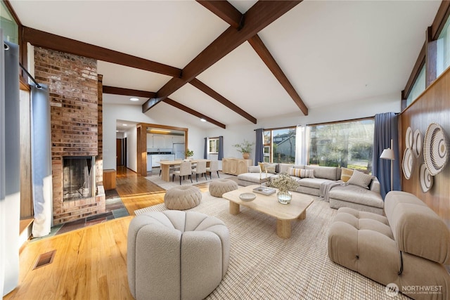 2104 E Ave, Anacortes, WA 98221 - living room featuring wood finished floors, recessed lighting, and a brick fireplace