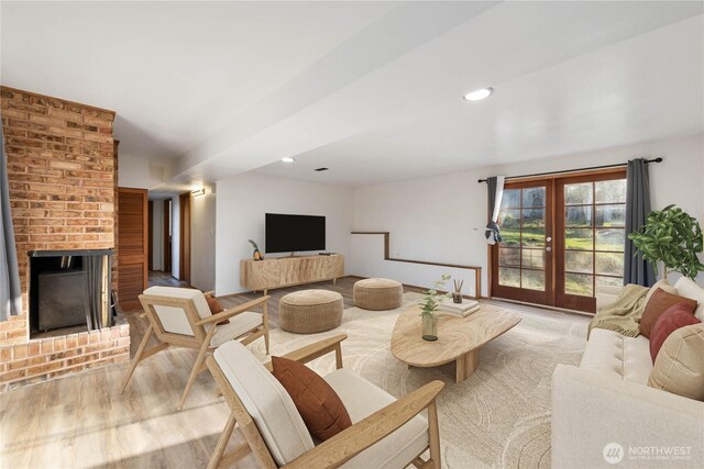 2104 E Ave, Anacortes, WA 98221 - living area with a brick fireplace, recessed lighting, and wood finished floors