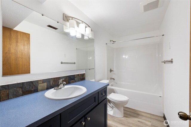 2104 E Ave, Anacortes, WA 98221 - full bath with vanity, wood finished floors, and  shower combination