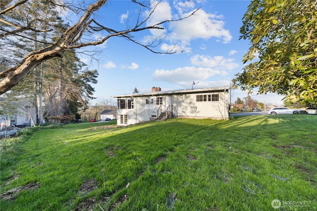 2104 E Ave, Anacortes, WA 98221 - rear view of property with a yard and a chimney