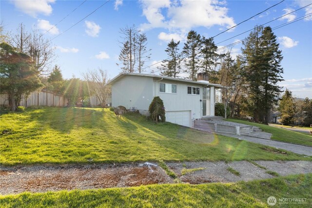 2104 E Ave, Anacortes, WA 98221 - view of property exterior with a garage, a chimney, a yard, and driveway
