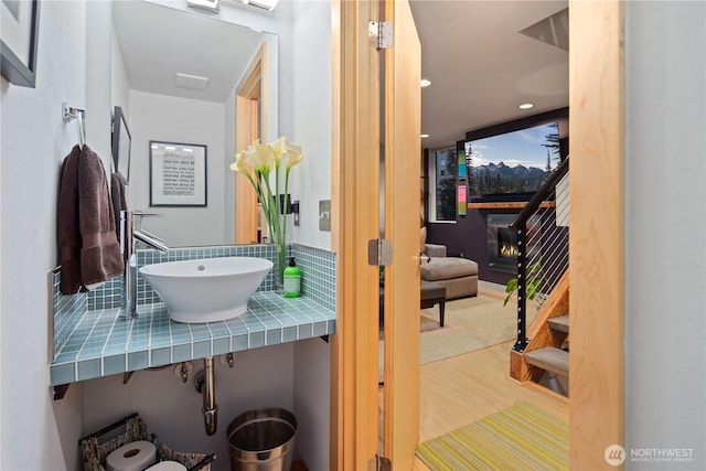 1115 24th Ave S, Seattle, WA 98144 - bathroom with decorative backsplash, wood finished floors, and recessed lighting
