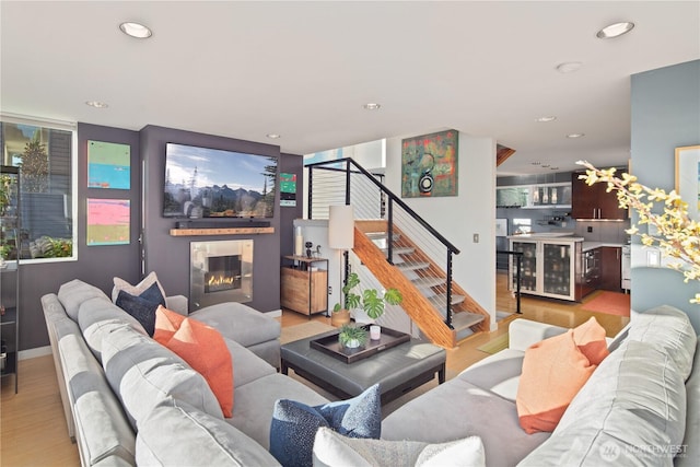 1115 24th Ave S, Seattle, WA 98144 - living room with stairway, wood finished floors, a glass covered fireplace, and recessed lighting