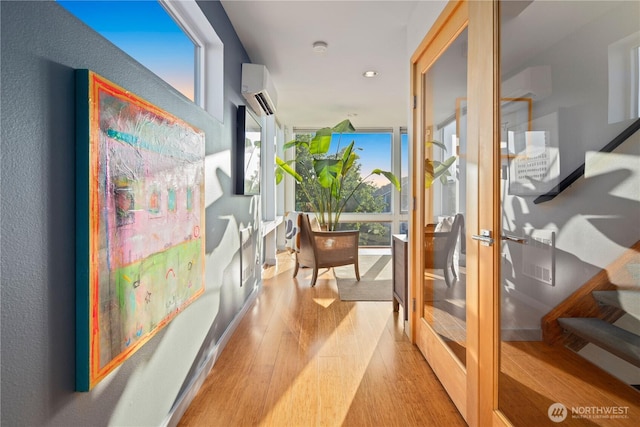 1115 24th Ave S, Seattle, WA 98144 - hall featuring a wall mounted air conditioner, wood finished floors, healthy amount of natural light, recessed lighting, and a wall mounted AC