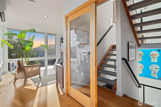 1115 24th Ave S, Seattle, WA 98144 - stairway featuring wood finished floors, recessed lighting, and an AC wall unit
