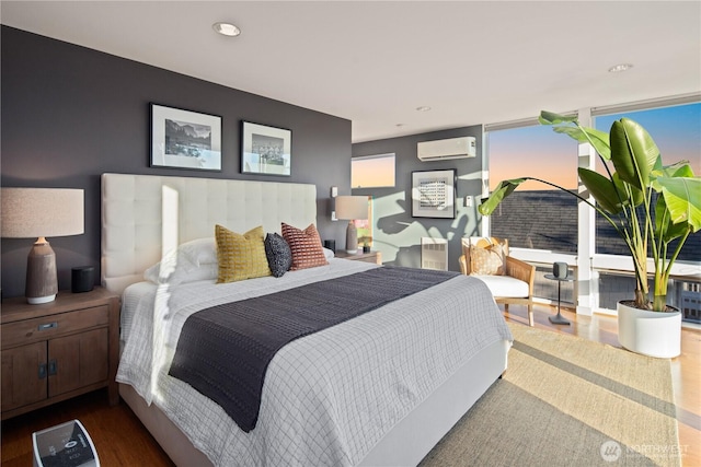 1115 24th Ave S, Seattle, WA 98144 - bedroom featuring a wall unit AC, dark wood finished floors, and recessed lighting