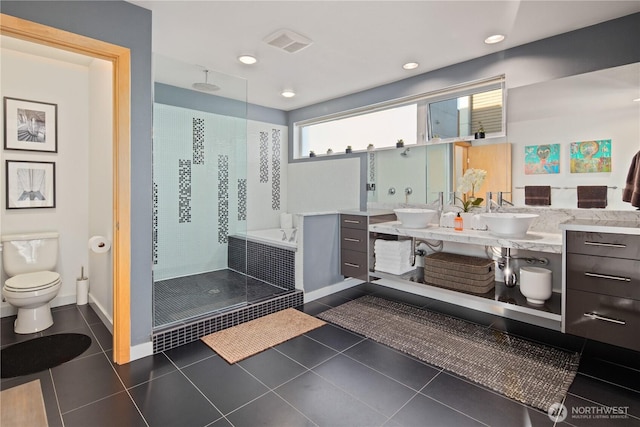 1115 24th Ave S, Seattle, WA 98144 - full bath with a stall shower, double vanity, and tile patterned flooring