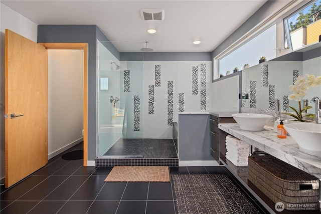 1115 24th Ave S, Seattle, WA 98144 - bathroom with a stall shower, double vanity, and tile patterned flooring