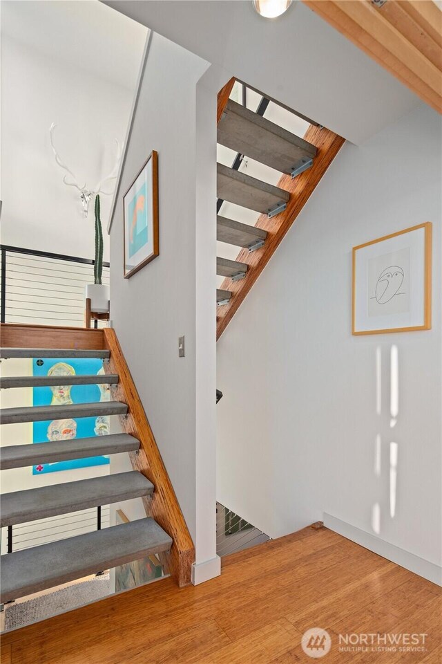 1115 24th Ave S, Seattle, WA 98144 - stairway featuring wood finished floors
