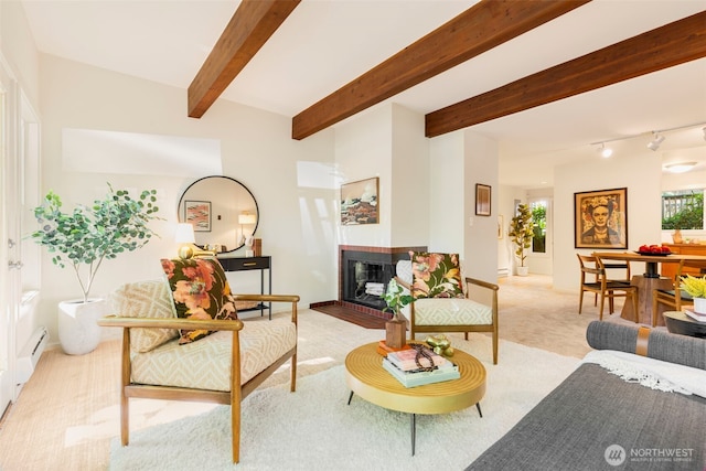 1717 16th Ave Unit 10, Seattle, WA 98122 - living area featuring light colored carpet, a fireplace, and beam ceiling