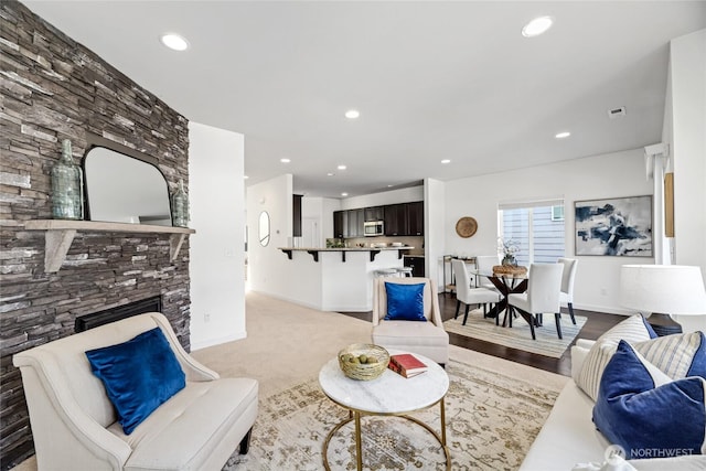 31 157th Ln SE, Bothell, WA 98012 - living room with recessed lighting, a fireplace, and carpet flooring
