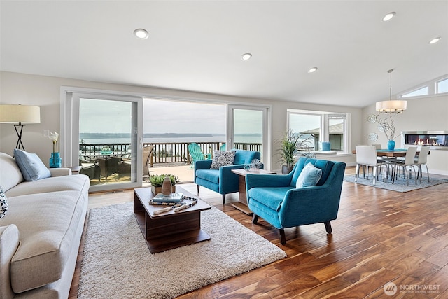 5530 Frances Ave NE, Tacoma, WA 98422 - living area featuring wood finished floors, recessed lighting, lofted ceiling, and a chandelier