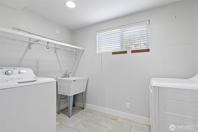 5530 Frances Ave NE, Tacoma, WA 98422 - laundry area featuring washer and dryer and baseboards
