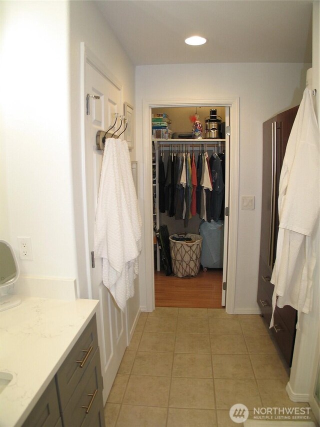 32404 G St, Ocean Park, WA 98640 - bathroom featuring tile patterned flooring, a walk in closet, vanity, and recessed lighting