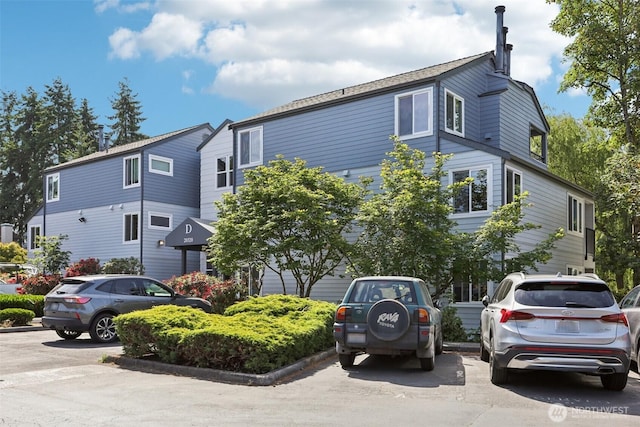 20320 Bothell Everett Hwy Unit D201, Bothell, WA 98012 - view of property featuring uncovered parking