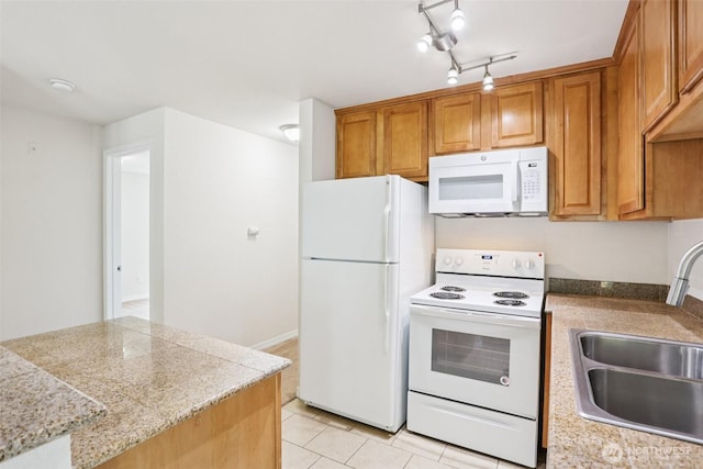 20320 Bothell Everett Hwy Unit D201, Bothell, WA 98012 - kitchen featuring white appliances, light countertops, brown cabinets, and light tile patterned floors