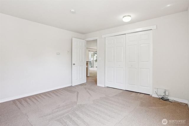 20320 Bothell Everett Hwy Unit D201, Bothell, WA 98012 - unfurnished bedroom featuring carpet floors and a closet