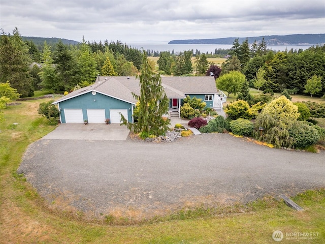 93 Old Schoolhouse Rd, Sequim, WA 98382 - view of front of property with asphalt driveway, an attached garage, and a water view