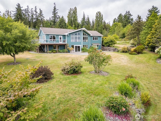 93 Old Schoolhouse Rd, Sequim, WA 98382 - rear view of property with a deck and a yard