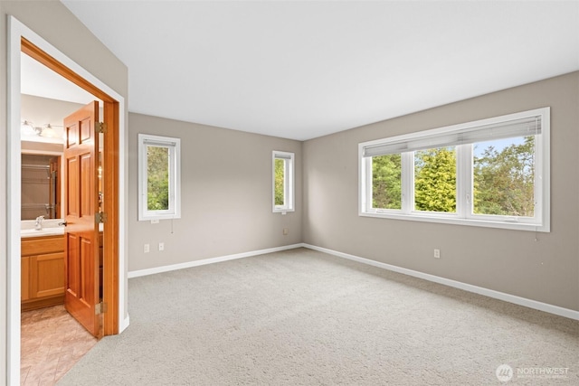 93 Old Schoolhouse Rd, Sequim, WA 98382 - spare room with baseboards and light colored carpet