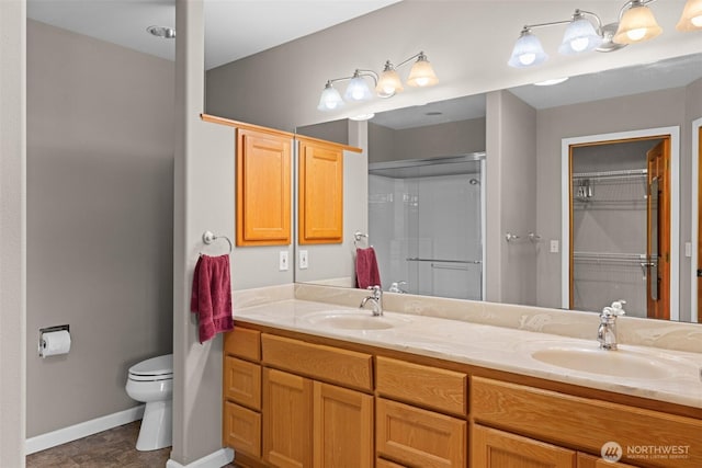 93 Old Schoolhouse Rd, Sequim, WA 98382 - bathroom with double vanity, a shower with door, and a spacious closet