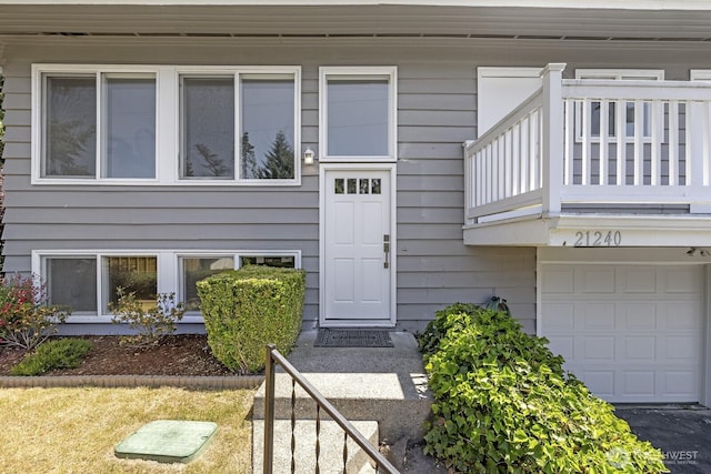 21240 15th Ave S, Des Moines, WA 98198 - doorway to property with a balcony and an attached garage