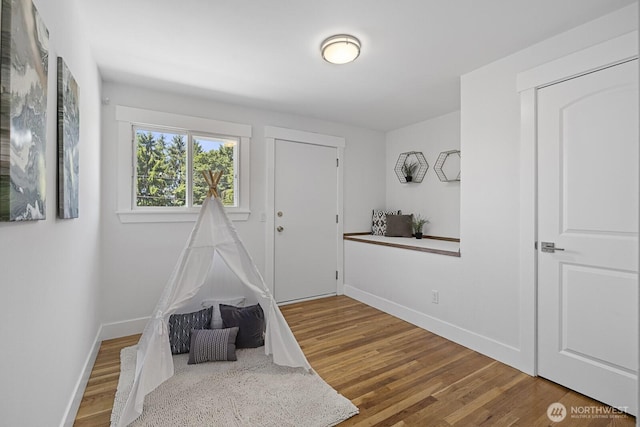 21240 15th Ave S, Des Moines, WA 98198 - playroom featuring baseboards and wood finished floors
