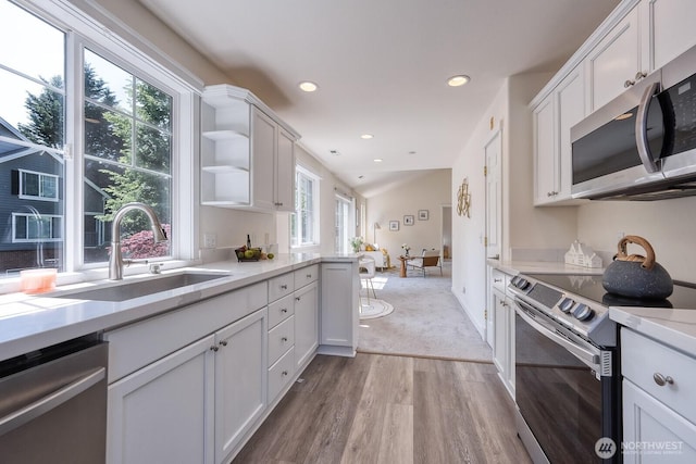 4121 248th Ct SE Unit 45, Sammamish, WA 98029 - kitchen with appliances with stainless steel finishes, light wood finished floors, white cabinets, recessed lighting, and open shelves