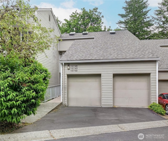 15732 NE 70th Ct, Redmond, WA 98052 - view of front of house with a shingled roof, driveway, and an attached garage