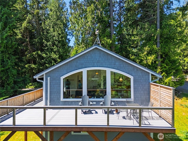 7773 Hideaway Ln, Anacortes, WA 98221 - view of side of property with a deck and outdoor dining space