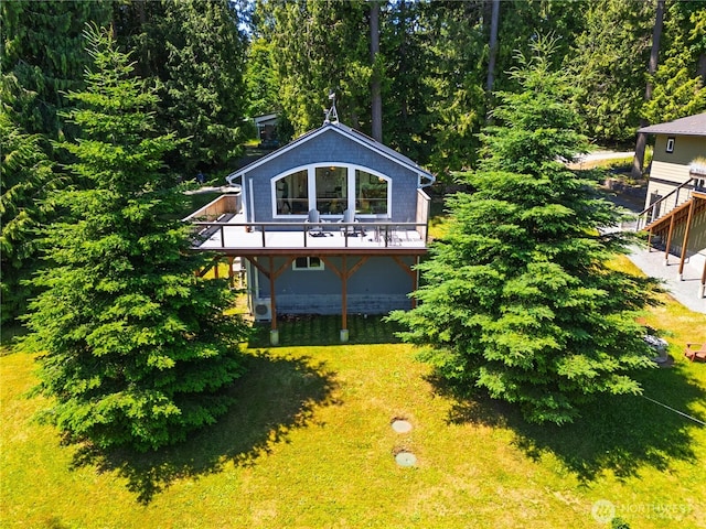 7773 Hideaway Ln, Anacortes, WA 98221 - view of side of home with stairs, a wooden deck, and a yard