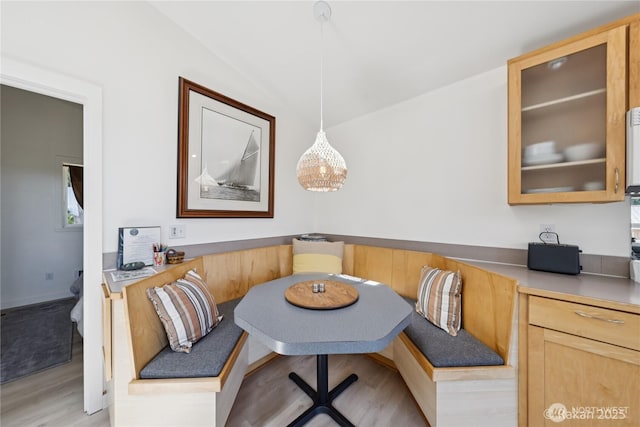 7773 Hideaway Ln, Anacortes, WA 98221 - dining room with light wood-type flooring and vaulted ceiling