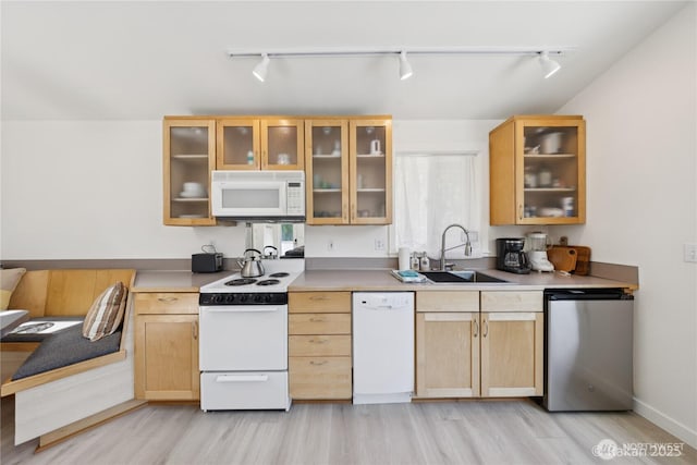 7773 Hideaway Ln, Anacortes, WA 98221 - kitchen featuring white appliances, rail lighting, and light brown cabinets