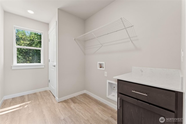 4043 98th Avenue Ct E Unit 24, Edgewood, WA 98371 - laundry area featuring hookup for a washing machine, light wood-style flooring, and cabinet space