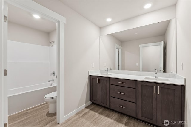 4043 98th Avenue Ct E Unit 24, Edgewood, WA 98371 - bathroom with wood finished floors, double vanity, shower / washtub combination, and recessed lighting