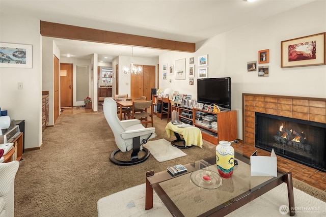 3939 108th Ave NE Unit A104, Bellevue, WA 98004 - living room featuring a tile fireplace, a chandelier, recessed lighting, carpet flooring, and beamed ceiling