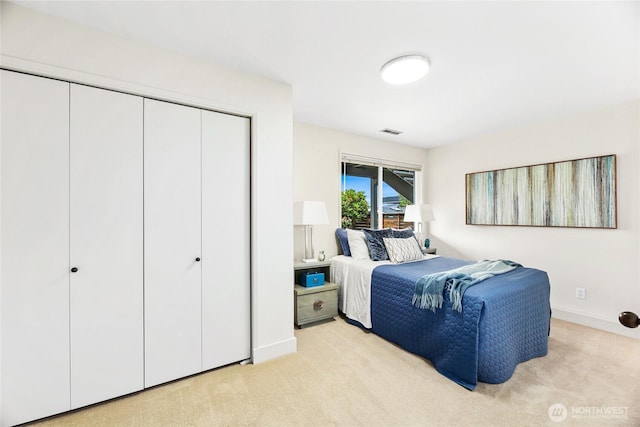 8751 Jones Ave NW, Seattle, WA 98117 - bedroom featuring light colored carpet and a closet