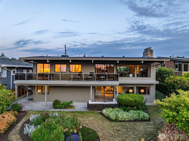 8751 Jones Ave NW, Seattle, WA 98117 - back of house featuring a patio area, a chimney, and outdoor lounge area