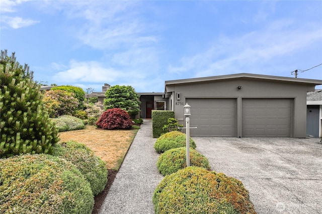 8751 Jones Ave NW, Seattle, WA 98117 - single story home with an attached garage and asphalt driveway