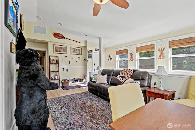 231 Benton, Leavenworth, WA 98826 - living room featuring vaulted ceiling, wood finished floors, and a ceiling fan