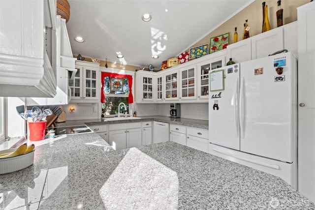 231 Benton, Leavenworth, WA 98826 - kitchen with white appliances, white cabinets, glass insert cabinets, recessed lighting, and tasteful backsplash