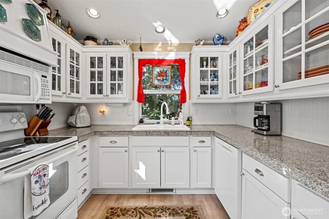 231 Benton, Leavenworth, WA 98826 - kitchen featuring white appliances, white cabinetry, and glass insert cabinets