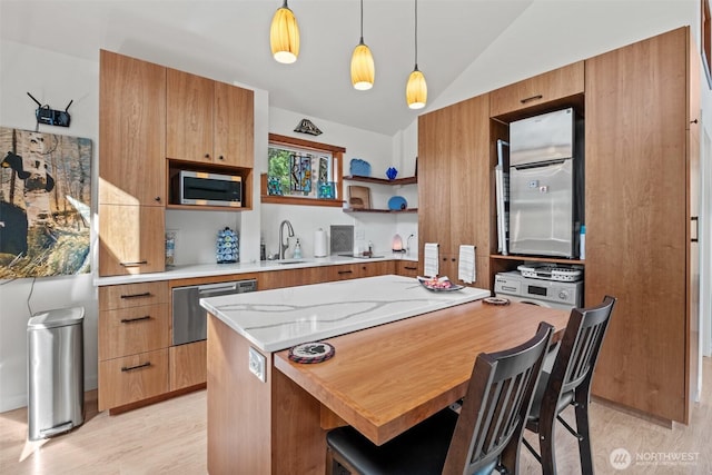231 Benton, Leavenworth, WA 98826 - kitchen with appliances with stainless steel finishes, vaulted ceiling, hanging light fixtures, open shelves, and modern cabinets