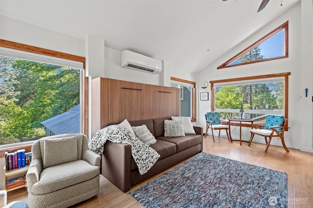 231 Benton, Leavenworth, WA 98826 - living area with an AC wall unit, a ceiling fan, high vaulted ceiling, and light wood-type flooring